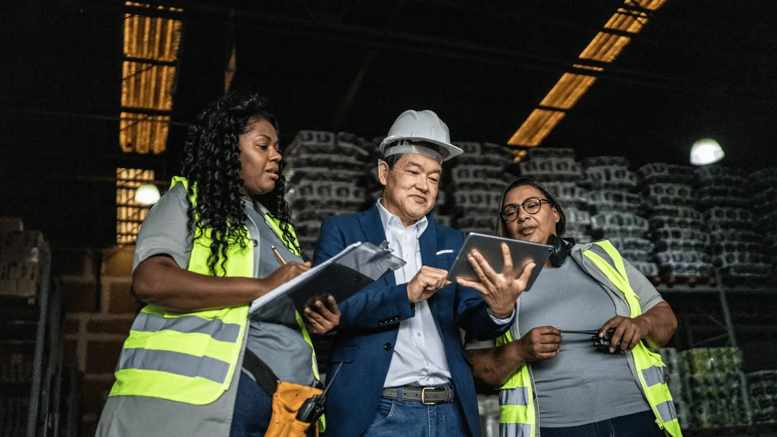 Construction team reviewing plans on tablet